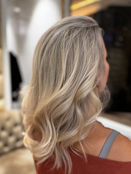 A close-up of the platinum bond hair highlights, showing the beautiful, cool-toned strands.