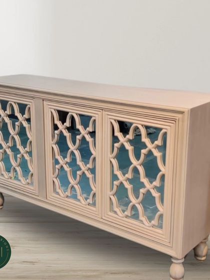 A studio shot of the lattice-door sideboard, highlighting its intricate craftsmanship and sophisticated design. This piece combines traditional motifs with a clean, modern finish.