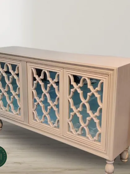 A studio shot of the lattice-door sideboard, highlighting its intricate craftsmanship and sophisticated design. This piece combines traditional motifs with a clean, modern finish.