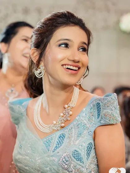 A smile that glows like magic. This close-up captures the fresh and radiant makeup perfect for a modern bride.