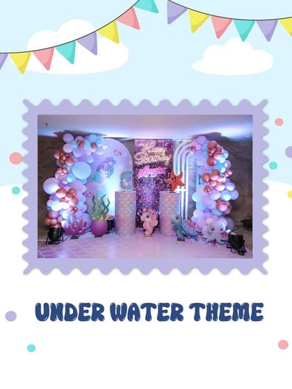 An indoor Under Water theme with a beautiful sequined backdrop. The decor includes balloon arches in shades of purple and rose gold, along with cute sea creature props like an octopus and starfish.