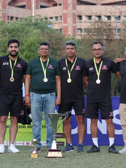 Our management and coaching staff proudly wearing their medals after a successful tournament.