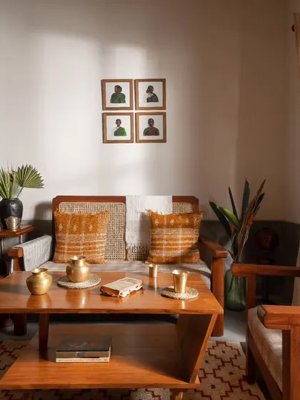 A full view of the living room seating arrangement. The furniture, textiles, and artwork were all chosen to create a cohesive, contemporary Indian aesthetic.