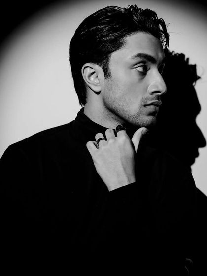 Playing with shadows to create a double profile effect. This artistic shot adds a layer of intrigue to a men's fashion portfolio.