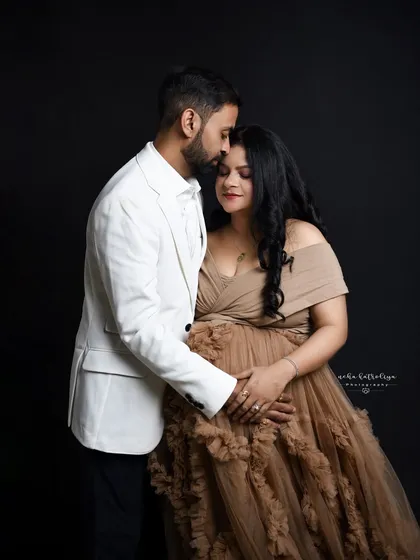 I love creating these dramatic and elegant maternity portraits in my studio. The use of a flowing gown, combined with moody, low-key lighting, really highlights the beauty and strength of the mother-to-be. This is a perfect way to celebrate your pregnancy.