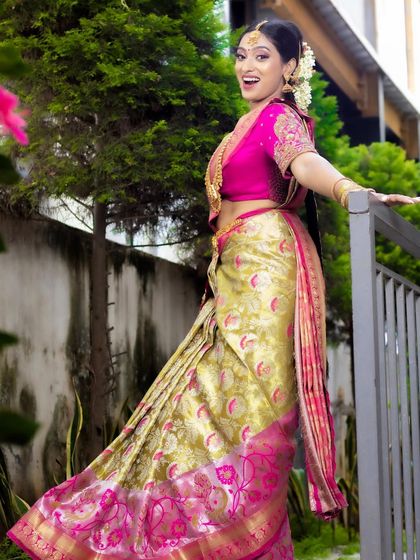 The movement of the saree and her joyful expression show how comfortable and confident she feels in her full bridal attire.