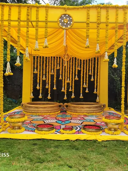 A Haldi ceremony should be full of life and color. We created this vibrant setup using a bold yellow frame, traditional marigold hangings, and a beautifully painted floor mat, designing a joyful space for this auspicious pre-wedding ritual.