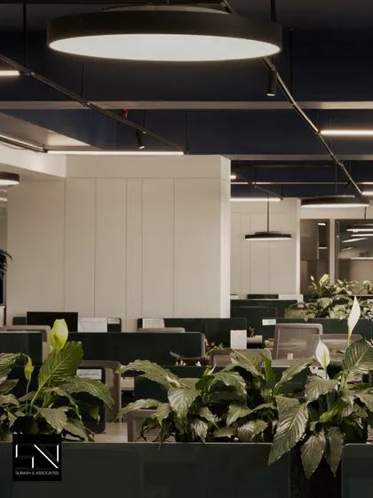 The open-plan office at Jubilee Headquarters, showing the arrangement of workstations and the use of circular overhead lighting. The design balances open, collaborative areas with a sense of personal space.