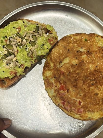 A delicious besan cheela (gram flour pancake) with an avocado sandwich. A perfect combination of protein and healthy fats.