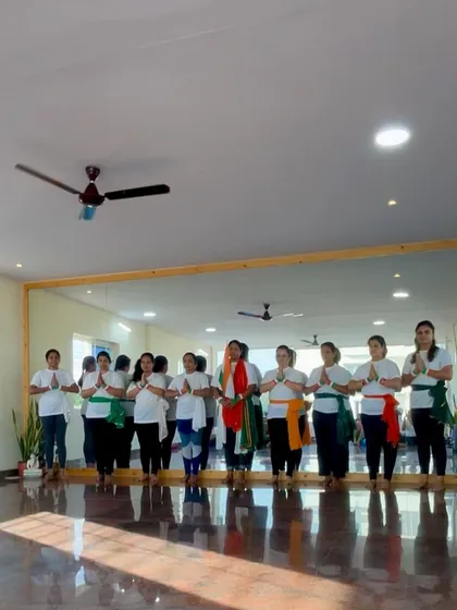 Our community standing together in honor of Independence Day. We bring the principles of unity and respect from our mats into our celebrations.