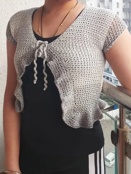 The Orchid Top is a perfect lightweight layer for adding a touch of handmade charm to your look.
