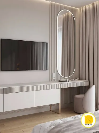 A sleek and modern dressing table with a backlit oval mirror. The ribbed texture on the console adds a subtle design detail.