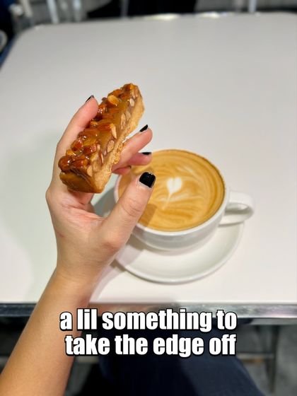 A crunchy almond florentine bar paired with a latte, the perfect coffee break combination.