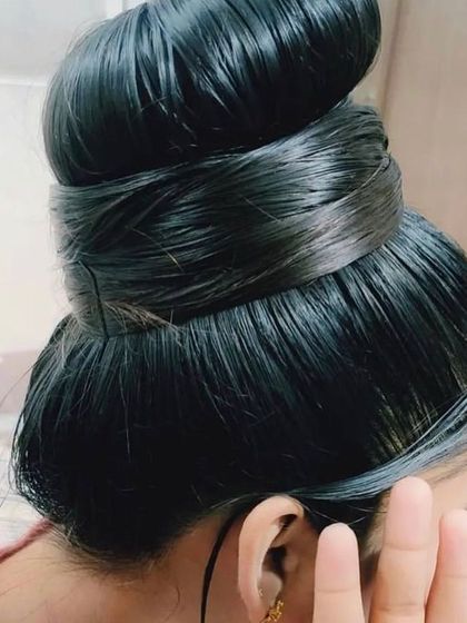A beautiful, thick hair bun showing the density and health of hair nourished by my Kanya oil. Strong hair is less prone to breakage and can be styled with confidence.