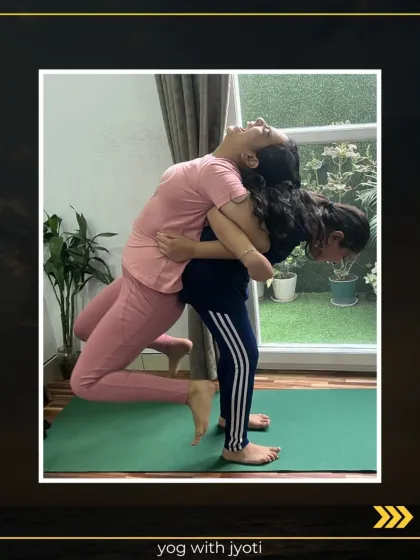 Two young girls practicing a partner backbend. This helps improve flexibility and builds a sense of connection and trust between them.