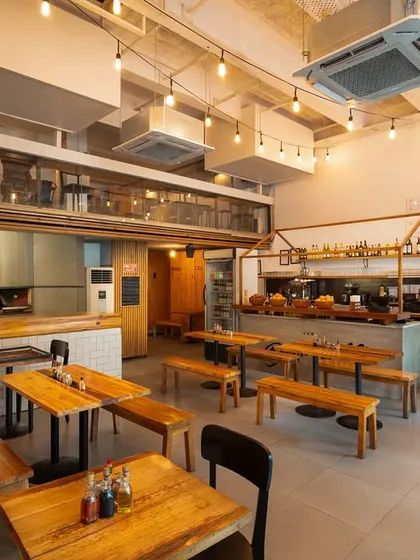 This is our space. We've designed it to be a cozy, rustic-modern spot where you can relax with friends, have a date night, or just enjoy a quiet solo meal.