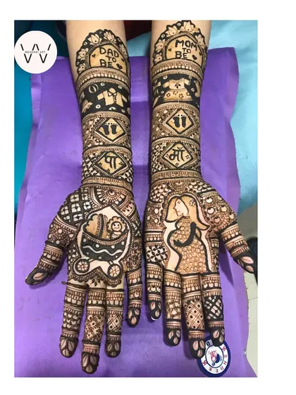 Celebrating a new life is always so special. This baby shower henna is filled with joy, featuring cute motifs like a baby carriage, tiny clothes, and loving "Mom to be" and "Dad to be" messages.
