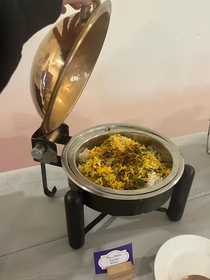 A close-up of my copper-finish chafing dish, holding a delicious vegetable biryani. This serveware not only looks great but also keeps the food perfectly warm.