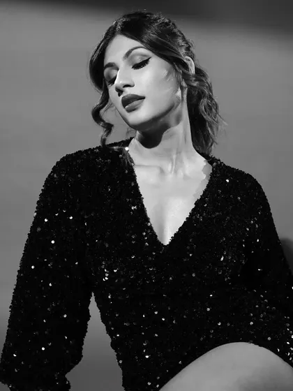 Monochrome magic. For this shoot, I created a classic glam look with bold lips and soft curls, translated into a timeless black and white image.