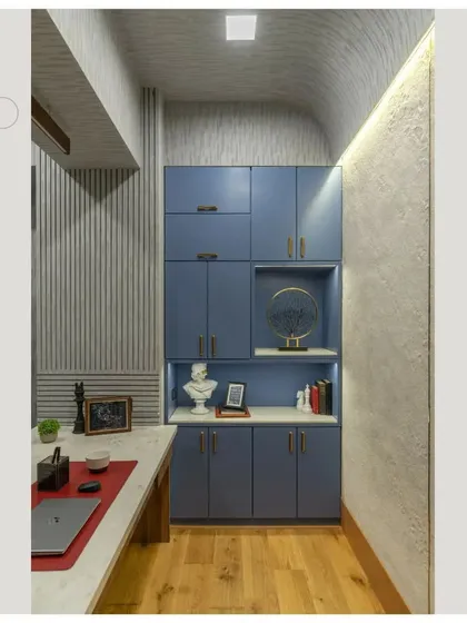 Another view of the director's cabin, showing the blue storage unit and the comfortable, high-back leather chair.