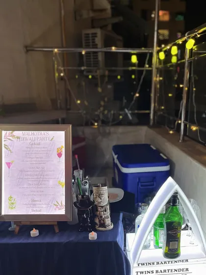 Our compact yet stylish bar setup on a balcony for a Diwali house party, complete with an LED menu and our signature triangular display.