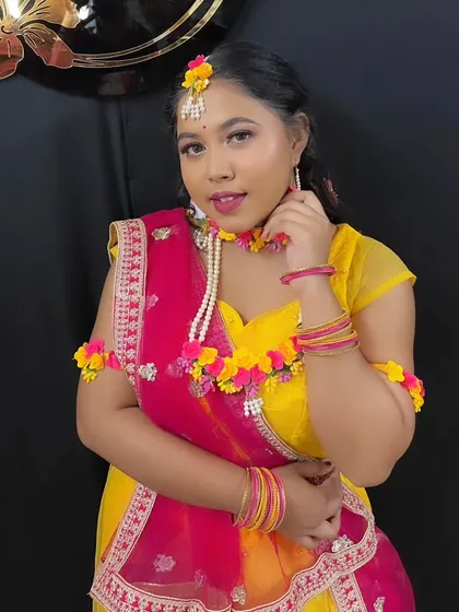 A close-up portrait that captures the joy and vibrancy of the Haldi ceremony look.