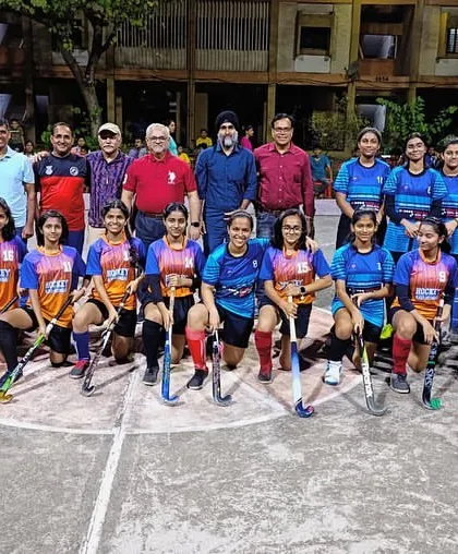 A snapshot of our vibrant hockey community. Players from our girls' exhibition match at the BARC Inter-Department Rink Hockey Event pose with officials and supporters, highlighting the inclusive and supportive network we've built.