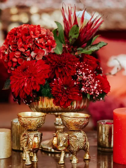 Intricate brass elephant-shaped bowls used as part of the decor. These small, traditional elements add a layer of cultural richness and visual interest.