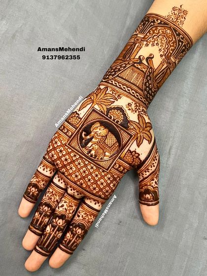 A classic bridal design featuring a royal elephant in a central frame. The surrounding patterns include palm trees and traditional jharokha architecture, giving it a Rajasthani feel.