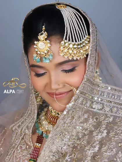 This close-up highlights the soft pink eyeshadow and the gentle contouring, creating a look of pure elegance for a Muslim bride.