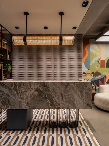 The mural as a backdrop for the office's reception area, creating a powerful first impression for clients. The artwork holds the pulse of a thousand stories of cities that never sleep.