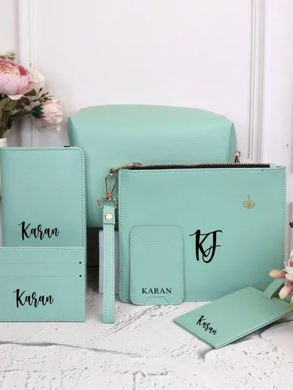 A beautiful mint-colored travel set, personalized for "Karan." The soft pastel color is perfect for a modern, aesthetic look.