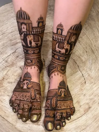 This design extends up the leg, featuring elephants and palace architecture. It’s a perfect choice for brides who want a grand, royal look for their feet mehndi.