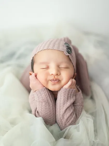 Such a perfect pout. This close up shot captures the delicate features and soft skin of a newborn, creating a portrait you will cherish.
