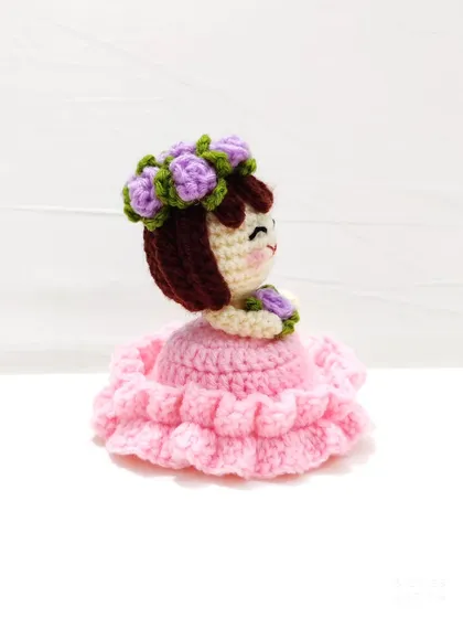 This reversible bouquet doll is two gifts in one. It starts as a beautiful floral bouquet and flips inside out to reveal an adorable doll in a pink frilly dress with a flower crown.