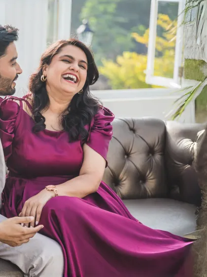 A moment of pure, uninhibited laughter. This candid shot captures the bride's joyful expression, showing the fun and relaxed atmosphere we create during our shoots.