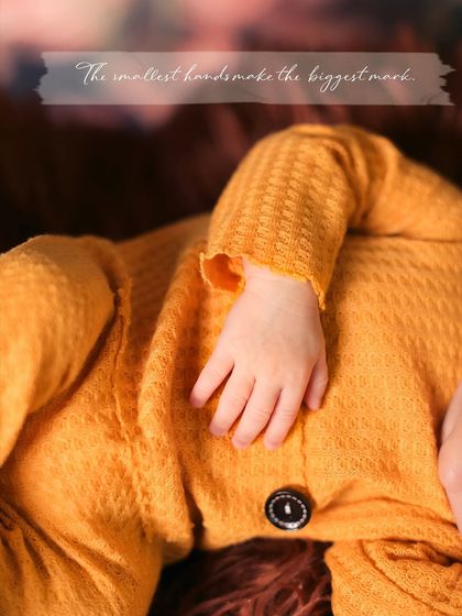 Focusing on the details. This macro shot of a newborn's tiny hand resting on their chest is a powerful reminder of how small and precious they are in these first few days.