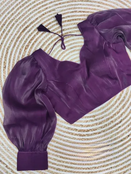 The organza blouse in a rich wine purple color.