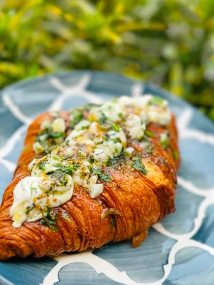 To show that we do more than just sweets, here is our popular Korean Cream Cheese Croissant. It's a savory, flaky croissant filled with a slightly sweet cream cheese and topped with a savory garlic and herb butter.