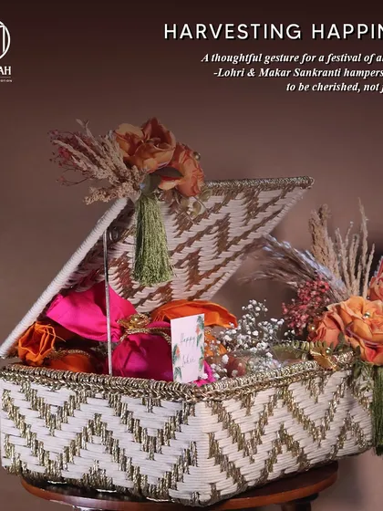 "Harvesting Happiness." A beautiful woven basket hamper for Lohri and Makar Sankranti, filled with festive goodies. This design is a thoughtful gesture for a festival of abundance.