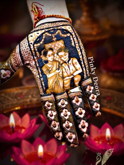 A beautiful portrait of a couple, framed by intricate patterns and delicate finger designs. This is the kind of art that turns an occasion into a lifelong memory, and I teach the techniques to achieve this level of detail.