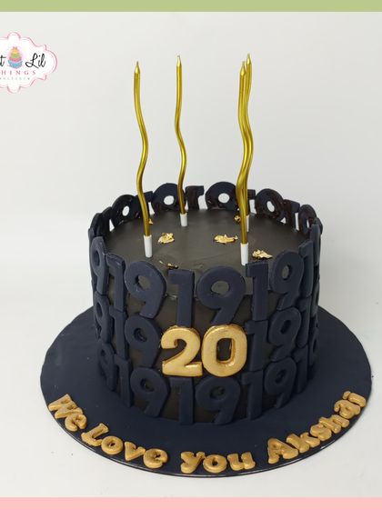 A chic and modern cake for a 20th birthday. The dark, moody design features a repeating number pattern and a bold gold "20" for a stylish milestone celebration.