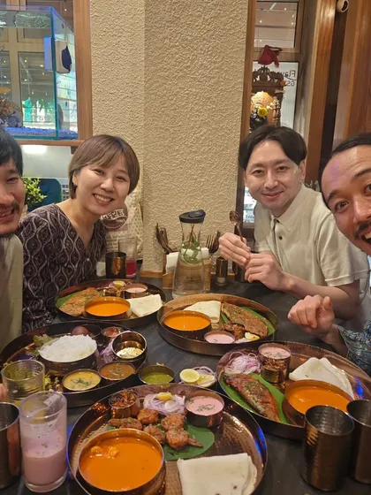 Nothing makes me happier than seeing friends from around the world, like my guests from Japan, enjoying a proper home-cooked Indian meal. Food truly connects us all, and I love sharing my culture through these authentic thalis.