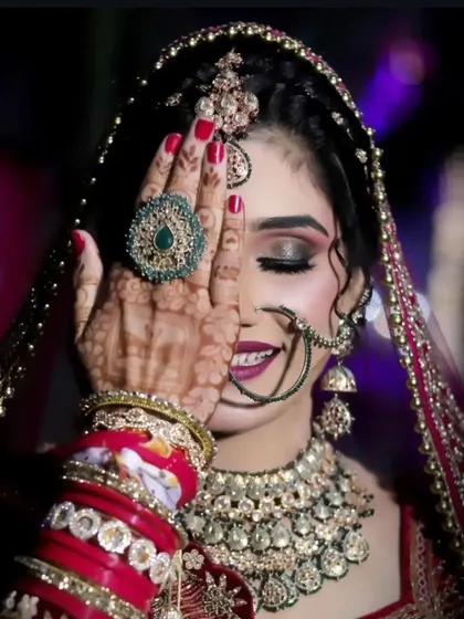 The perfect bridal shot! Seeing a happy bride like this, with her mehndi complementing her entire look, is the best part of my job. This is the kind of joy and beauty I aim to create for you.
