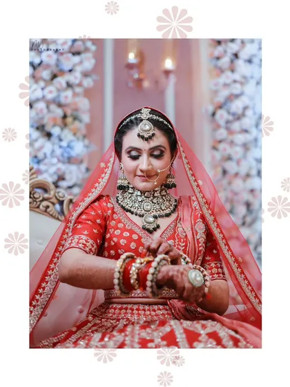 A candid moment of the bride adjusting her bangles. These small moments are where the beauty of the complete look truly shines.