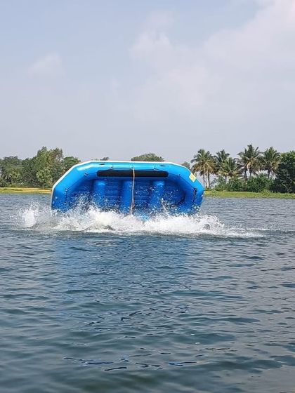 A raft is intentionally flipped during a training exercise at our Ambigarahalli center. This drill prepares participants for real-world scenarios.