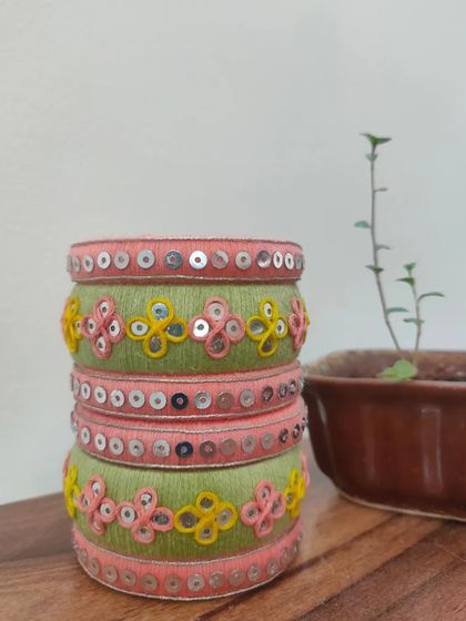A closer look at my pastel green and pink bangles. These are intricately decorated with thread embroidery and sequin work, and can be made in any color combination you desire.