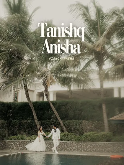 A modern fairytale moment. The couple walks hand-in-hand by the poolside, framed by palm trees, perfectly capturing the essence of a chic destination wedding.