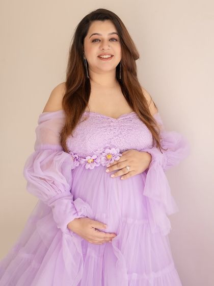 A happy and glowing portrait in a lovely lavender gown. Her bright smile is the best accessory.