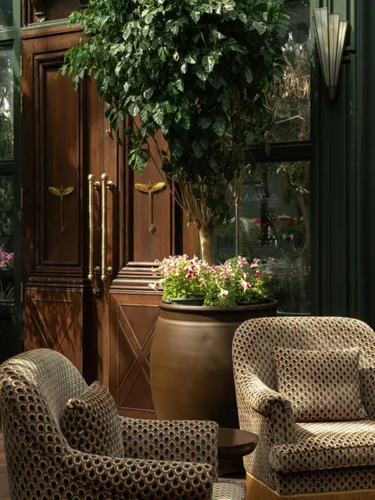 A detail of the entrance doors and custom hardware, showcasing the attention to detail in the design.